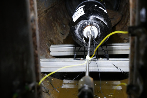 Composite pressure vessel with integrated fibre-optic sensors immediately before a burst test. Composite pressure vessel with integrated fibre-optic sensors immediately before a burst test.
