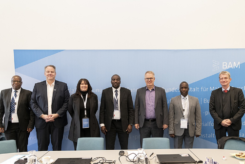 Employees of BAM and the University of Namibia in front of a BAM banner Employees of BAM and the University of Namibia in front of a BAM banner