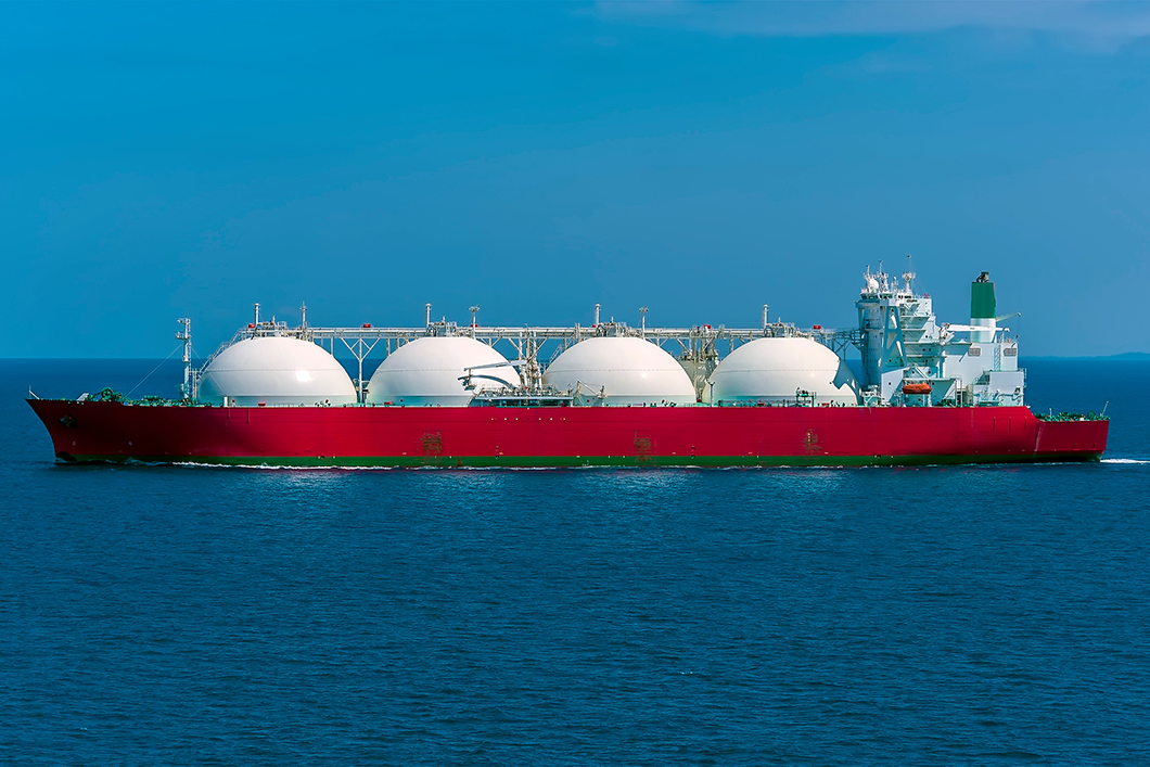 A red ship with four white spherical tanks.  A red ship with four white spherical tanks.