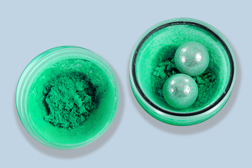 Turquoise chemical substances in glass jars