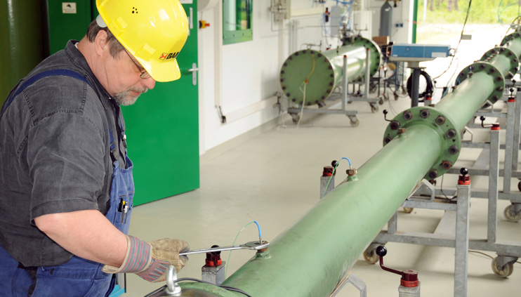 A BAM employee works on a pipe for a gas test explosion. A BAM employee works on a pipe for a gas test explosion.